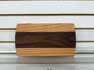 Wooden cutting board with a striped pattern on a white background
